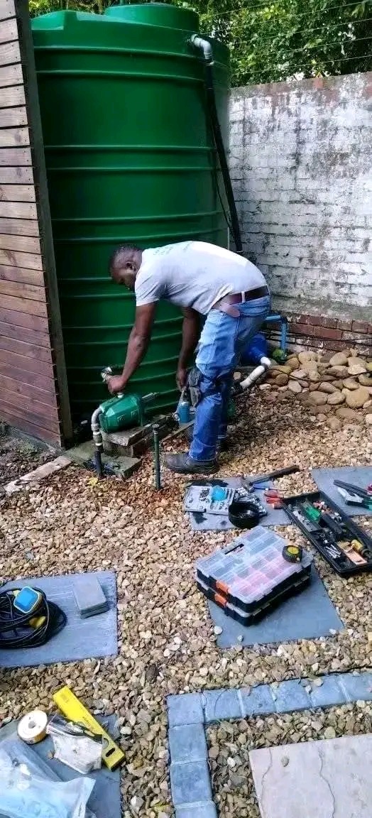 Steve plumbing a rainwater tank and pressure pump